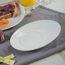 Bon Chef 1100005P Slanted Oval 7 5/8" X 5 1/4" White Porcelain Saucer - 36/Case