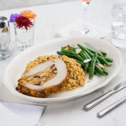 Acopa 12 5/8" X 9 1/4" Ivory (American White) Scalloped Edge Oval Stoneware Platter - 12/Case