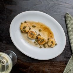 Acopa 9 3/4" X 7 1/2" Bright White Oval Coupe Stoneware Platter - 24/Case -Rak Porcelain shop 1570864