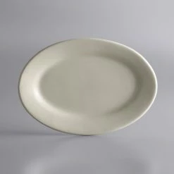 World Tableware PWC-12 Princess White 10 1/2" X 7 1/2" Ultima Cream White Rolled Edge Oval Stoneware Platter - 24/Case