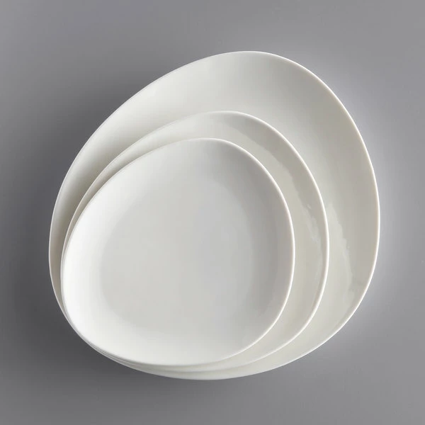 Acopa Nova 10 1/4" Cream White Organic Coupe Stoneware Plate - 12/Case 4 Acopa Nova 10 1/4" Cream White Organic Coupe Stoneware Plate - 12/Case - Image 4