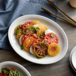 Acopa 13" X 10 1/2" Bright White Narrow Rim Oval Stoneware Platter - 12/Case