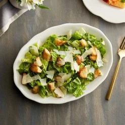 Acopa 11 5/8" X 8 1/2" Ivory (American White) Scalloped Edge Oval Stoneware Platter - 12/Case