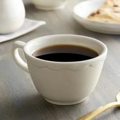 Acopa 7 Oz. Ivory (American White) Scalloped Edge Stoneware Coffee Cup / Mug - 36/Case