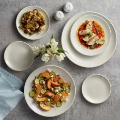 Acopa 11" Round Ivory (American White) Coupe Stoneware Plate - 12/Case -Rak Porcelain shop 1897479