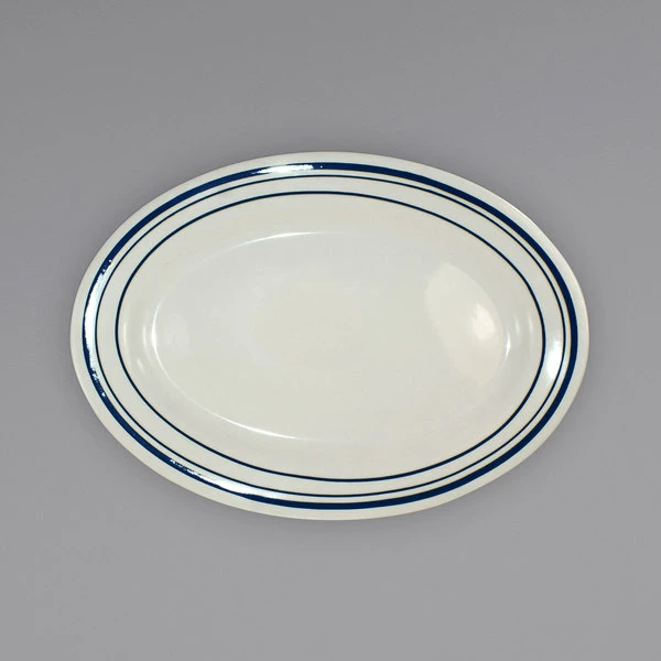 International Tableware CT-13 Catania 11 1/2" X 8 1/4" Ivory (American White) Stoneware Platter With Blue Bands - 12/Case 1 International Tableware CT-13 Catania 11 1/2" X 8 1/4" Ivory (American White) Stoneware Platter With Blue Bands - 12/Case
