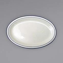 International Tableware DA-14 Danube 13 1/4" X 10 3/8" Ivory (American White) Blue Speckled Narrow Rim Stoneware Platter With Blue Bands - 12/Case