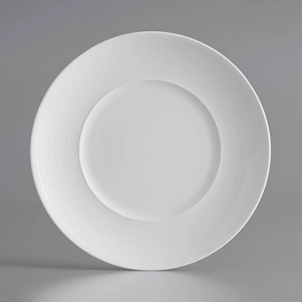 Acopa Liana 8 1/4" Bright White Embossed Lines Wide Rim Porcelain Plate - 24/Case 2 Acopa Liana 8 1/4" Bright White Embossed Lines Wide Rim Porcelain Plate - 24/Case - Image 2