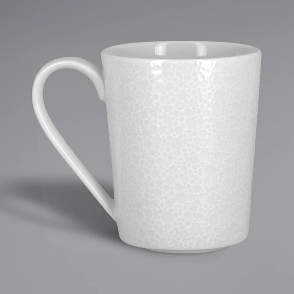RAK Porcelain CHPASMG36 Charm 12.15 Oz. Bright White Embossed Porcelain Mug - 12/Case 1 RAK Porcelain CHPASMG36 Charm 12.15 Oz. Bright White Embossed Porcelain Mug - 12/Case