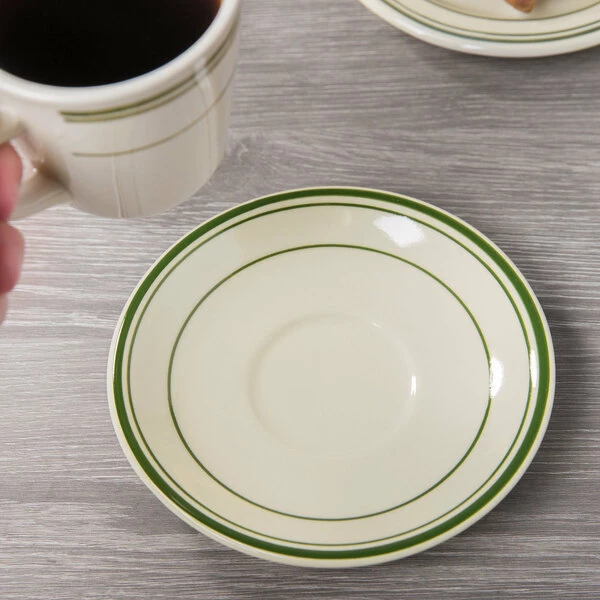World Tableware VIC-2 Viceroy 6" Ivory (American White) Rolled Edge Stoneware Saucer With Green Bands - 36/Case 1 World Tableware VIC-2 Viceroy 6" Ivory (American White) Rolled Edge Stoneware Saucer With Green Bands - 36/Case