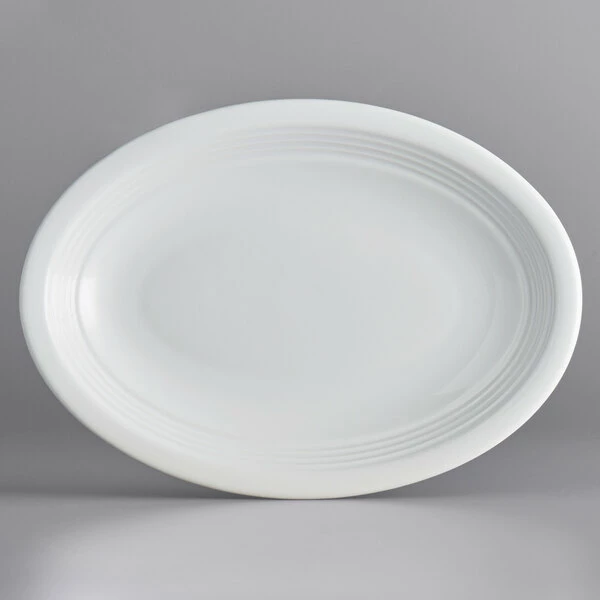Acopa Capri 9 3/4" X 7" Coconut White Oval Stoneware Coupe Platter - 12/Case 2 Acopa Capri 9 3/4" X 7" Coconut White Oval Stoneware Coupe Platter - 12/Case - Image 2