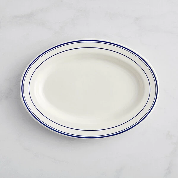 Acopa 12 5/8" X 8 3/4" Ivory (American White) Wide Rim Stoneware Platter With Blue Bands - 12/Case 2 Acopa 12 5/8" X 8 3/4" Ivory (American White) Wide Rim Stoneware Platter With Blue Bands - 12/Case - Image 2