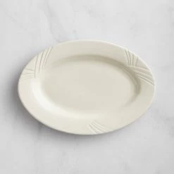 Acopa Swell 11 3/4" X 8 1/4" Ivory (American White) Embossed Wide Rim Oval Stoneware Platter - 12/Case 5 Acopa Swell 11 3/4" X 8 1/4" Ivory (American White) Embossed Wide Rim Oval Stoneware Platter - 12/Case -Rak Porcelain shop 2165288