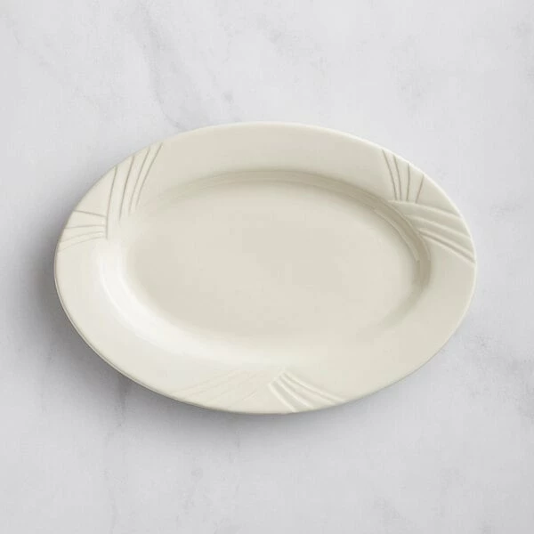 Acopa Swell 11 3/4" X 8 1/4" Ivory (American White) Embossed Wide Rim Oval Stoneware Platter - 12/Case 2 Acopa Swell 11 3/4" X 8 1/4" Ivory (American White) Embossed Wide Rim Oval Stoneware Platter - 12/Case - Image 2