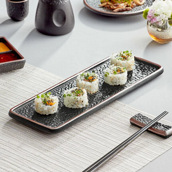 Acopa Heika 12 3/8" X 4 1/2" Black Matte Textured Rectangular Flat Stoneware Plate - 12/Case 1 Acopa Heika 12 3/8" X 4 1/2" Black Matte Textured Rectangular Flat Stoneware Plate - 12/Case