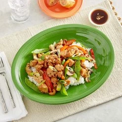 Acopa Capri 13 3/4" X 10 1/2" Palm Green Oval Stoneware Coupe Platter - 12/Case -Rak Porcelain shop 2211159