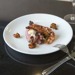 Chef & Sommelier FN510 Infinity 10 5/8" White Coupe Bone China Plate By Arc Cardinal - 12/Case