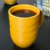 Syracuse China 903033004 Cantina 11 Oz. Saffron Carved Porcelain Mug - 12/Case